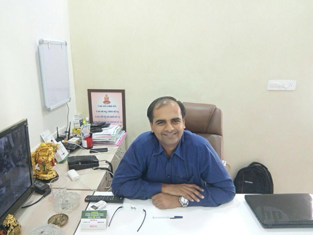 Dr. Urvish Doshi at his consultation desk